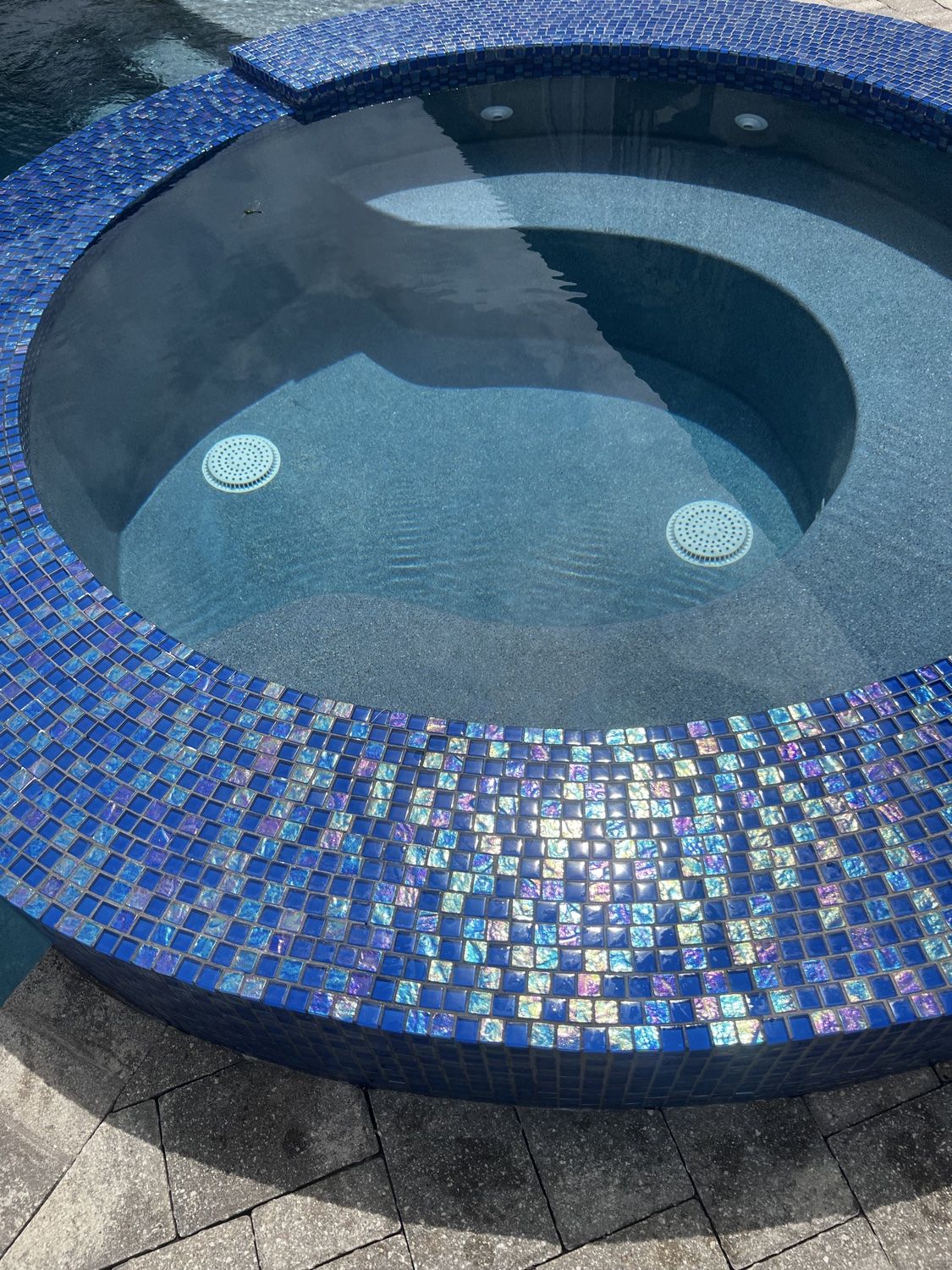 Finished spa with clean blue mosaic tile